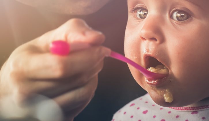 Feeding a five month old baby with a spoon