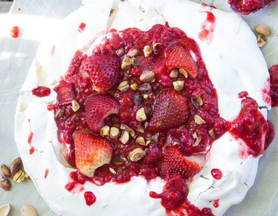 Pistachio Pavlova with Cream and Mixed Berry and Rhubarb Sauce