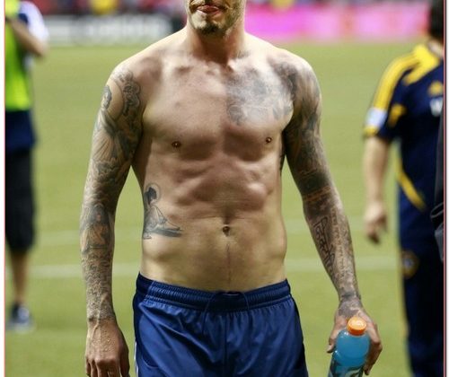 Shirtless Soccer Star David Beckham Heads Off Field After Match