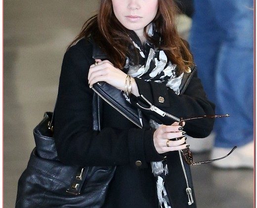 Lily Collins Touches Down In Paris