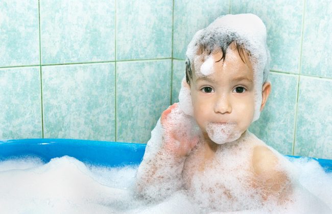 boy-in-the-bath-covered-in-bubbles