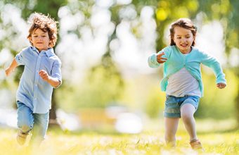 boy-girl-running-park