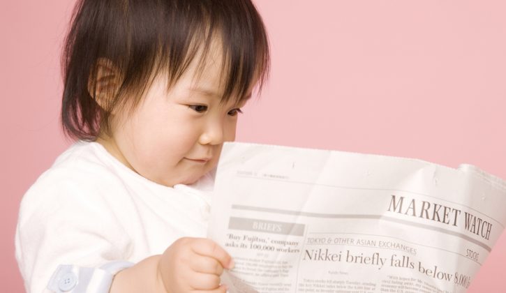 Baby Reading Newspaper