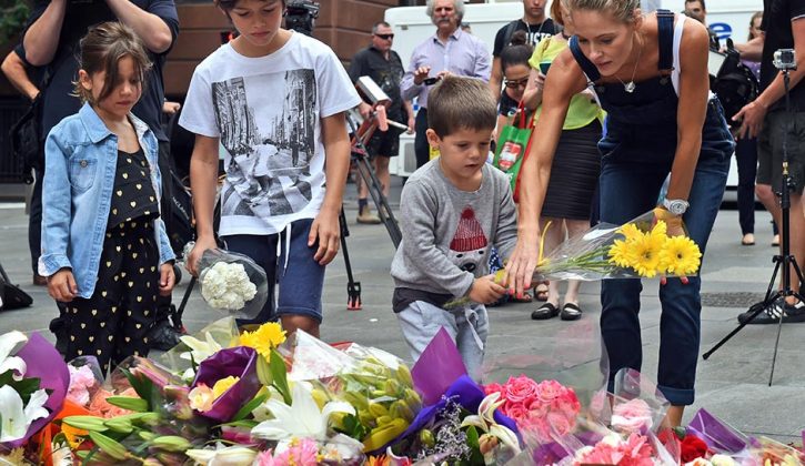 children-lay-flowers-at-martin-place-data